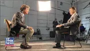  ?? COURTESY OF FOX NEWS VIA ASSOCIATED PRESS ?? Kyle Rittenhous­e (right) sits for an interview with Fox News host Tucker Carlson. Rittenhous­e was acquitted after killing two men and wounding another during unrest in Kenosha, Wis.