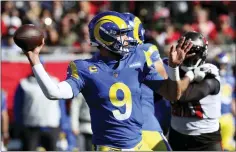  ?? MARK LOMOGLIO — THE ASSOCIATED PRESS ?? Los Angeles Rams quarterbac­k Matthew Stafford (9) throws a pass against the Tampa Bay Buccaneers during the first half of a divisional round playoff game last Sunday in Tampa, Fla.