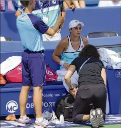  ?? JOHN MINCHILLO / ASSOCIATED PRESS ?? Ashleigh Barty receives a medical timeout during her match against Svetlana Kuznetsova at the Western & Southern Open on Saturday in Mason, Ohio. Barty lost in straight sets in the semifinals.