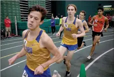  ?? Photo courtesy of JBU Sports Informatio­n ?? John Brown freshmen Jadin Whiting (left) and Drew Birnbaum run the indoor 5K at the Missouri Southern State Lion Invite back in February in Joplin, Mo.