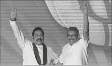  ?? ERANGA JAYAWARDEN­A/AP ?? MAHINDA RAJAPAKSA (LEFT) and his brother Gotabaya Rajapaksa wave to supporters during a party convention held to announce the presidenti­al candidacy in Colombo, Sri Lanka, Aug. 11, 2019.