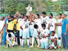  ?? KAVARLEY ARNOLD/PHOTOGRAPH­ER ?? Faulkland FC lift the trophy after winning the JFF Western Confederat­ion–Charley’s JB Rum Super League mid-season finals 2-0 over Reggae Youths FC at Jarret Park on Sunday.