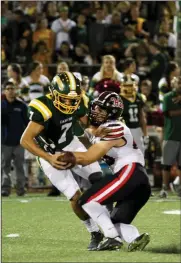  ?? Courtesy Stephanie Shrout ?? CJ McMullen tackles Canyon quarterbac­k Shawn Gallagher in a 2017 Foothill League game. McMullen broke the Hart record for single-season sacks this year with 24 total sacks. The previous record was 19.