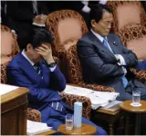  ?? — AFP ?? Prime Minister Shinzo Abe ( left) and finance minister Taro Aso attend an Upper House Budget Committee meeting on March 8.