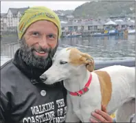  ??  ?? Chris Lewis and constant companion Jet stop off in Oban while walking the UK coastline for SSAFA, the armed forces charity.