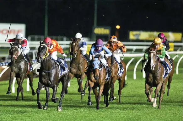  ??  ?? TOP RIDE: Bequeathed (red colours) and jockey Nozi Tomizawa head for victory in Saturday’s Class 1 Handicap at Clifford Park.