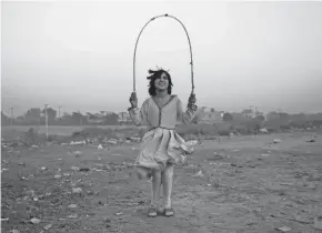  ?? RAHMAT GUL/AP ?? A girl jumps rope on the outskirts of Islamabad, Pakistan, Wednesday.