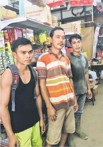  ??  ?? Three Indonesian men (from left) Wing, Lajung and Joe in Lachau to shop for Gawai yesterday.