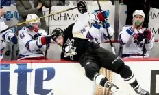  ?? Matt Freed/Post-Gazette ?? Maxim Lapierre gets up close and personal with the Rangers bench in Game 4 Wednesday at Consol Energy Center.