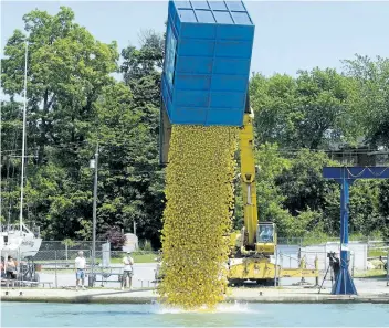  ?? JULIE JOCSAK/STANDARD FILE PHOTO ?? People line the Port Dalhousie pier for the 17th annual Kiwanis Duck Race in June 2011. The ducks won’t be racing this year because of Lake Ontario’s high water levels, but there is a backup plan.