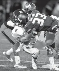  ?? AP/BRADLEY LEEB ?? Illinois linebacker Tre Watson (33) hits Western Kentucky wide receiver Nacarius Fant (1) during the second quarter Sept. 9 in Champaign, Ill. Watson was called for targeting and was ejected from the game.