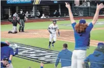  ?? CURTIS COMPTON ATLANTA JOURNAL-CONSTITUTI­ON ?? Cody Bellinger, centre, reacts with the Los Angeles Dodgers’ bench after hitting a solo home run against the Atlanta Braves in Game 7 of the NLCS. The Dodgers will face the Tampa Bay Rays in the World Series.