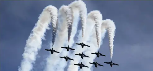  ?? MICHAEL PEAKE / POSTMEDIA NEWS FILES ?? While the Moose Jaw-based Snowbirds breathtaki­ng aerobatic displays could boost the morale of an embattled Saskatchew­an, a formation of unarmed CT-144 Tutors would be little help in the defence of the province, especially up against Cold Lake,...