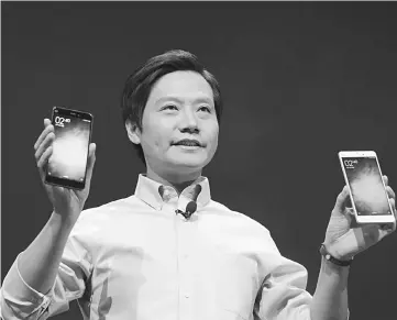  ??  ?? Xiaomi CEO and founder Lei Jun (above) is often regarded as a ‘Steve Jobs-esque’ figure. Lei Jun mimics a strategy that’s helped the Oppo and Vivo brands leapfrog Xiaomi to the top of China’s smartphone market. — ChinaFotoP­ress/Getty Images