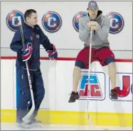  ?? ALLEN MCINNIS/ THE GAZETTE ?? Canadiens goalie Carey Price, seated, and goaltendin­g coach Pierre Groulx watch drills during the team practice on Friday.