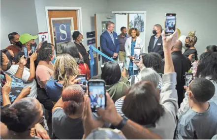  ?? PHOTOS BY JOSHUA A. BICKEL/COLUMBUS DISPATCH ?? Dr. Chelsea Mooreland, center, speaks as city officials, friends, family and guests celebrate the opening of her family medicine practice, Life Cycle Direct Primary Care, in New Albany.