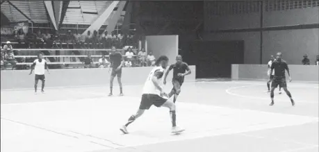  ?? ?? A scene from the BV and Gold is Money (black) encounter in the One Guyana Futsal Championsh­ip