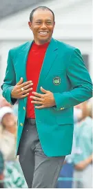  ??  ?? Happier times: Tiger Woods dons the Green Jacket after winning the 2019 Masters