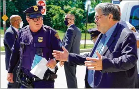  ?? MIKE BALSAMO/ ASSOCIATED PRESS ?? Attorney GeneralWil­liam Barr addresses officers with the Cleveland Police Department about Operation Legend during an Aug. 20 appearance in the city. Barr also visited Detroit and Kansas City.