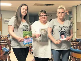  ?? THE NEWS ?? Kevin Martin’s mother Bonnie Thomas (centre) and her surviving children Samantha (L) and Danielle hold up pictures of their loved one at the Stellarton Legion on May 19.