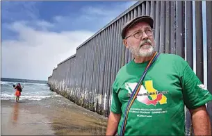  ?? PHOTO BY DON BARTLETTI ?? Gonzalo Santos, then an associate professor at Cal State Bakersfiel­d, poses near the U.S.-Mexico border fence in Tijuana, Mexico, on Aug. 17, 2017. He is part of the Dreamers return program conducted by the Long Beach-based California-Mexico Studies Center Inc.