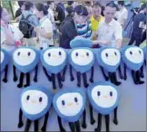  ?? PROVIDED TO CHINA DAILY ?? Visitors check sales informatio­n at the stall of Ant Financial, Alibaba’s financial arm, at the Cyber Security Expo in Wuhan, Hubei province, in September 2016.