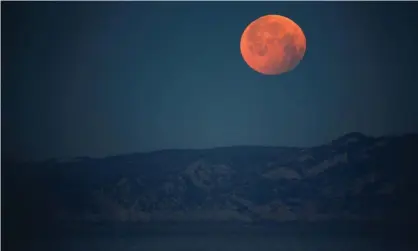 ??  ?? A super blood moon in Marseille, France, 2019. You can look at this year’s May 2021 full supermoon and total lunar eclipse on Wednesday in Australia, over all of Oceania, most of south-east Asia and the Americas. Photograph: Jean-Paul Pélissier/Reuters