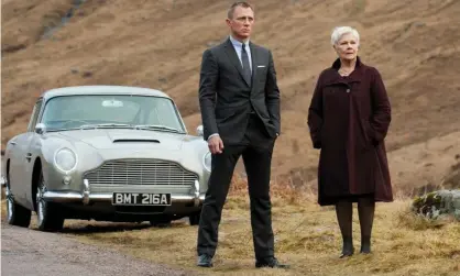  ??  ?? Climate change … Daniel Craig and Judi Dench with an eco-unfriendly Aston Martin in Skyfall. Photograph: Allstar/Columbia Pictures/Eon/ Danjaq