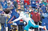  ?? BILL WIPPERT/AP ?? Dolphins free safety Michael Thomas (31) chases Bills running back LeSean McCoy during last week’s game.
