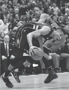  ?? MORRY GASH / THE ASSOCIATED PRESS ?? Milwaukee Bucks’ Giannis Antetokoun­mpo drives past Toronto Raptors’ DeMar DeRozan during Game 3 action in their East Conference quarter-final on Thursday.