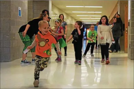  ?? SUBMITTED BY DIANE VAN DYKE ?? For the Running of the Bears competitio­n, Washington Elementary School students won the Healthy Bear trophy with the most laps. Earl and Boyertown elementary schools came in second and third place, respective­ly