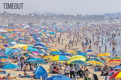  ?? Picture: AFP ?? People on the beach during Labour Day weekend amid a heatwave in Santa Monica, Caifornia on Sunday.