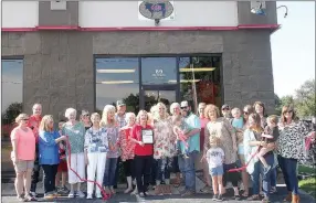  ?? LYNN KUTTER ENTERPRISE-LEADER ?? Farmington Area Chamber of Commerce sponsored a ribbon cutting ceremony to welcome Chic Gypsy Boutique as the newest Chamber member. The store opened in July at 89 W. Main St., in Farmington. Store owner Malorie Smith, center, cuts the ribbon at the...