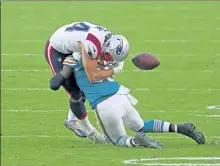  ?? JOEL AUERBACH / AP ?? Patriots rookie tight end Dalton Keene drops the ball after a crushing hit from Dolphins linebacker Jerome Baker on Sunday in Miami.