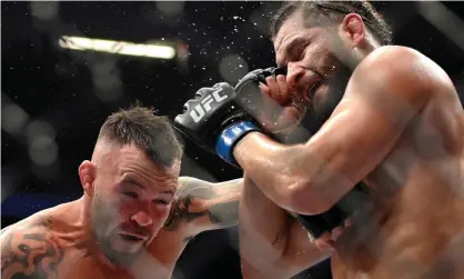  ?? Becker/Getty Images ?? Colby Covington, left, and Jorge Masvidal battle in their welterweig­ht fight during UFC 272 atT-Mobile Arena in March. Photograph: David