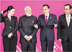  ?? PHOTO: REUTERS ?? ( From left) New Zealand’s Prime Minister Jacinda Ardern, Prime Minister Narendra Modi, Chinese Premier Li Keqiang, and Thai Prime Minister Prayuth Chan-ocha at the 3rd Regional Comprehens­ive Economic Partnershi­p (RCEP) summit in Bangkok, Thailand, on Monday