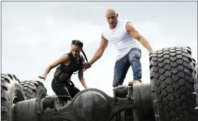  ??  ?? Nathalie Emmanuel, left, and Vin Diesel in a scene from “F9.”