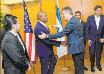 ?? Michael Appleton
Tribune News Service ?? New York City Mayor Eric Adams meets with Israeli Minister of Foreign Affairs Eli Cohen on Tuesday in Jerusalem. A N.Y. group bankrolled Adams’ stay.