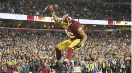  ??  ?? LANDOVER: Washington Redskins tight end Jordan Reed celebrates his touchdown catch during the second half of an NFL football game against the New York Giants in Landover, Md., Sunday.—AP