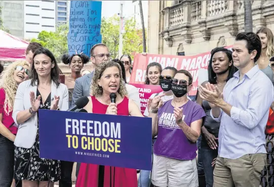  ?? PEDRO PORTAL pportal@miamiheral­d.com ?? U.S. Rep. Debbie Wasserman Schultz of South Florida speaks at a pro-choice rally Tuesday outside the Freedom Tower in downtown Miami. She joined Florida Agricultur­e Commission­er and Democratic candidate for governor Nikki Fried, far left, and Miami Commission­er Ken Russell, far right.