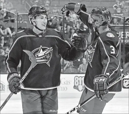  ?? [BARBARA J. PERENIC/DISPATCH] ?? Zach Werenski, left, and Seth Jones have formed a bond as the Blue Jackets’ top defensive pair.