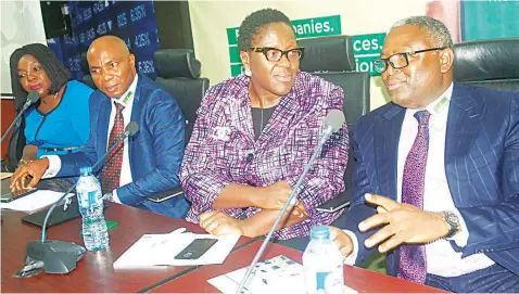 ?? PHOTO: SUNDAY AKINLOLU ?? Managing Director, Meristem Registrars and Probate Services Limited, Mubo Olasoko (left); Deputy Group Managing Director, Meristem Securities Limited, Sulaiman Adedokun; General Counsel/head of Regulation­s, Nigerian Stock Exchange, Tinu Awe and Group...