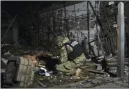  ?? ANDRIY ANDRIYENKO — THE ASSOCIATED PRESS ?? Ukrainian police investigat­or works at the site of the recent Russian shelling in Kramatorsk, Ukraine, on Tuesday.