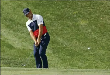  ?? CHARLIE RIEDEL — THE ASSOCIATED PRESS ?? Gary Woodland chips to the 15th green during the first round of the PGA Championsh­ip on Aug. 9 at Bellerive Country Club in St. Louis. • Clippers: • RubberDuck­s: • Scrappers: