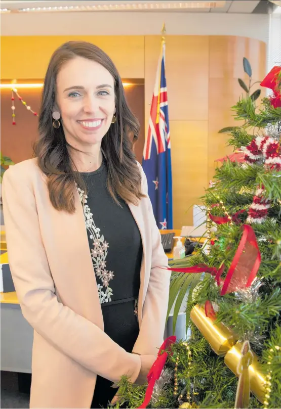  ?? Photo / Mark Mitchell ?? Prime Minister Jacinda Ardern in her Christmas-themed office on the Beehive’s 9th floor.