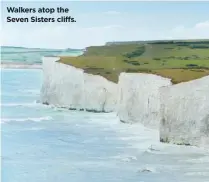  ??  ?? Walkers atop the Seven Sisters cliffs.