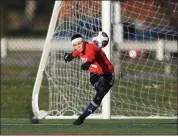  ?? TIM PHILLIS — FOR THE NEWS-HERALD ?? Kirtland goalkeeper Corinne Aquila plays a goal kick Nov. 7 during a 6-1 Division III regional final win over South Range at Mentor.