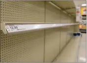  ??  ?? The toilet paper shelves at Target remain completely empty Saturday in Chico.