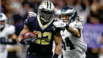  ?? CHRIS GRAYTHEN / GETTY IMAGES ?? Partly because of a four-game suspension, Mark Ingram (running past the Eagles’ Cre’von LeBlanc last weekend) had not produced the numbers he has had in previous seasons, but he helps give the Saints a multidimen­sional rushing threat.