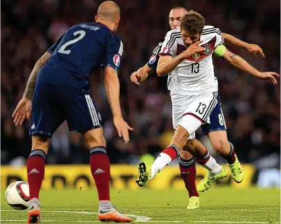  ?? AP ?? Lucky strike: Muller grabs his first of the night with a deflected shot to dent Scotland’s hopes